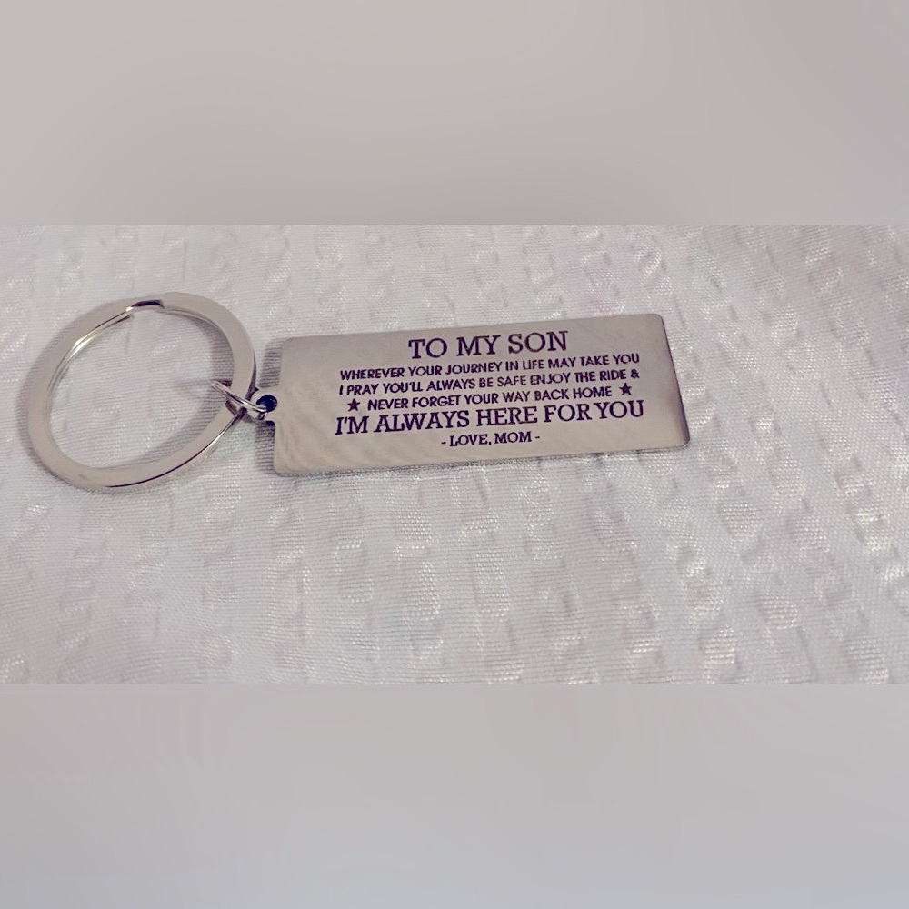 Elegant Silver-toned Keychain with Engraved Tag